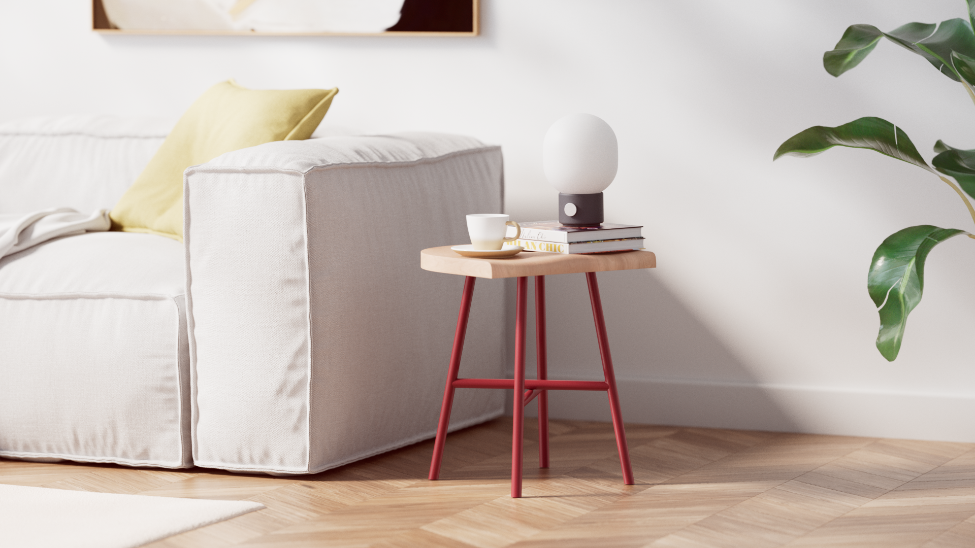 Tabouret bas Camarade en hêtre massif et acier couleur rouille aux côtés d'un canapé 