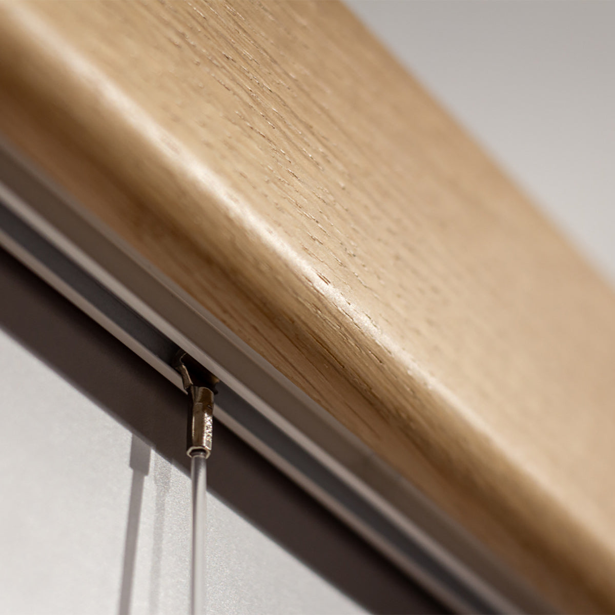 Variand V03 picture rail in situ — oak with hanging frames — Variand design | Antifer